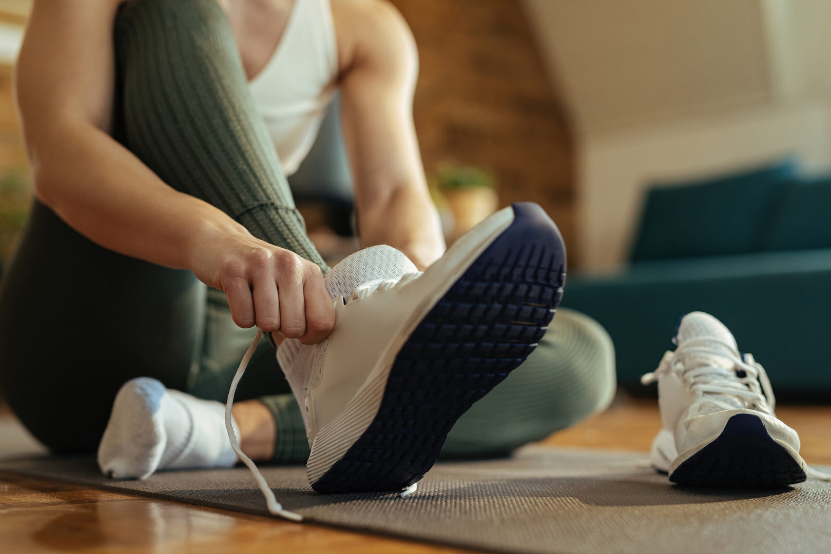 Close Up Of Athletic Woman Putting On Sneakers.